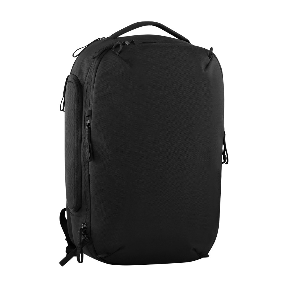 A black laptop backpack with multiple zippered compartments and a top carry handle, shown from a three-quarter angle on a plain white background.