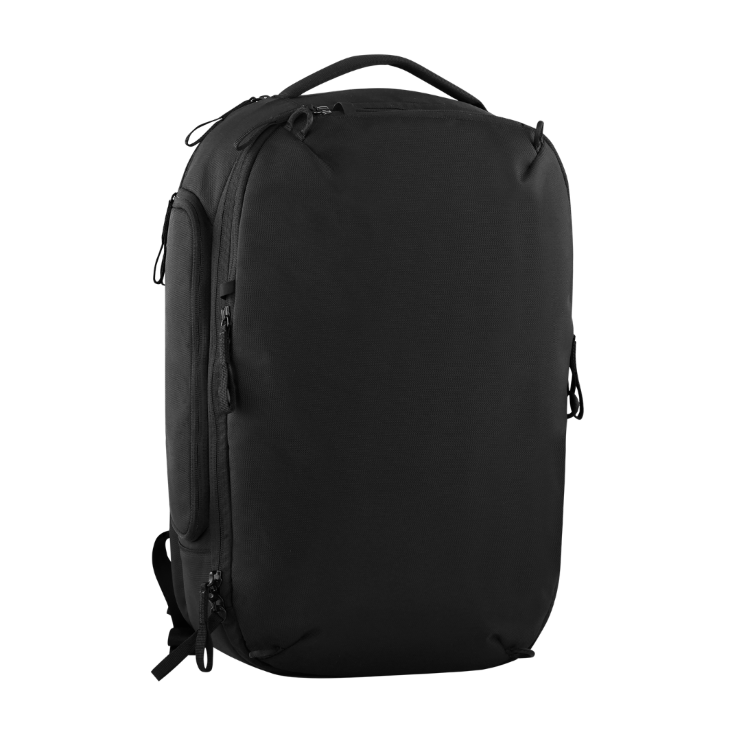 A black laptop backpack with multiple zippered compartments and a top carry handle, shown from a three-quarter angle on a plain white background.
