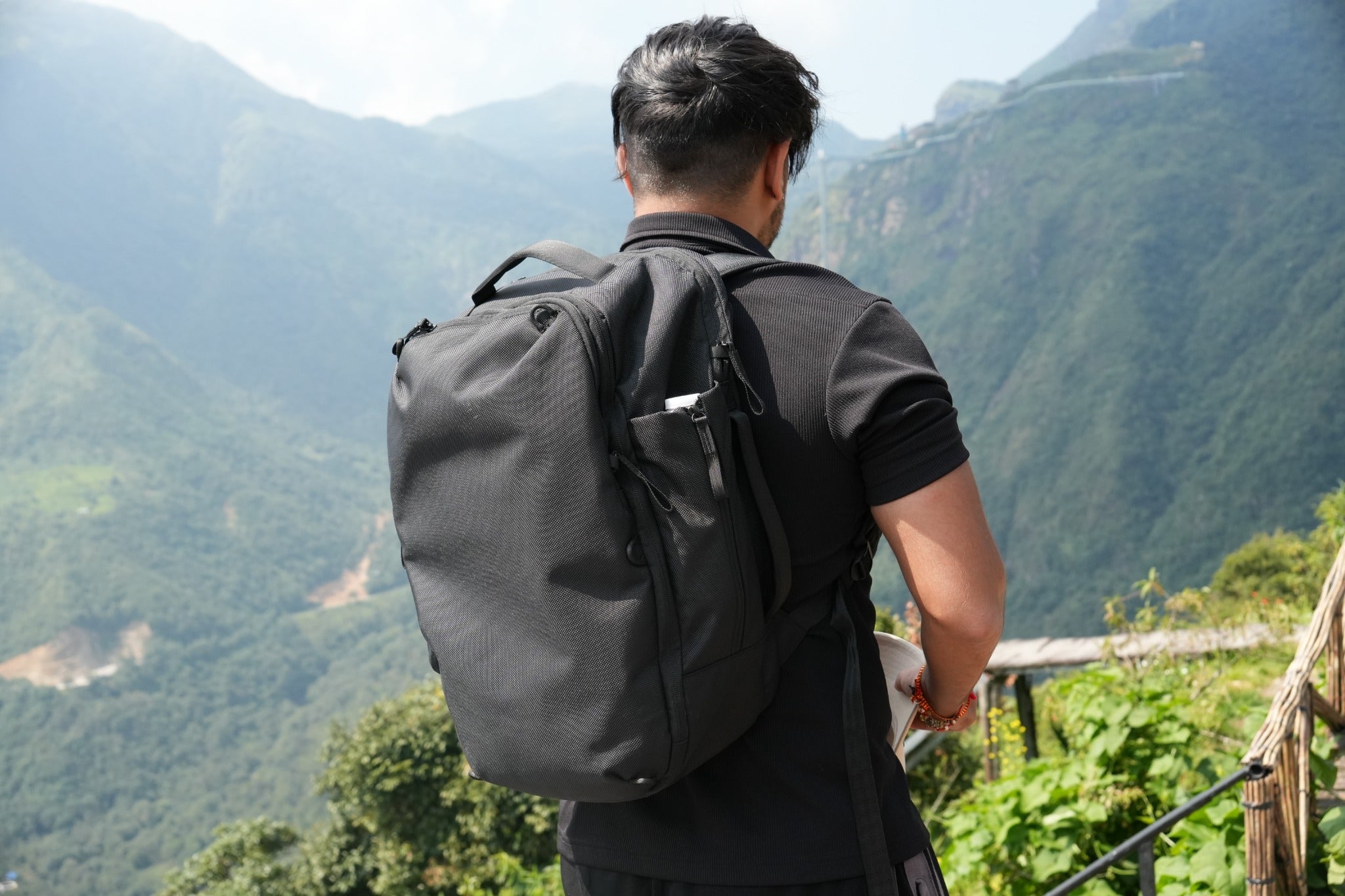 A person wearing Daily Dash overlooking a mountain valley